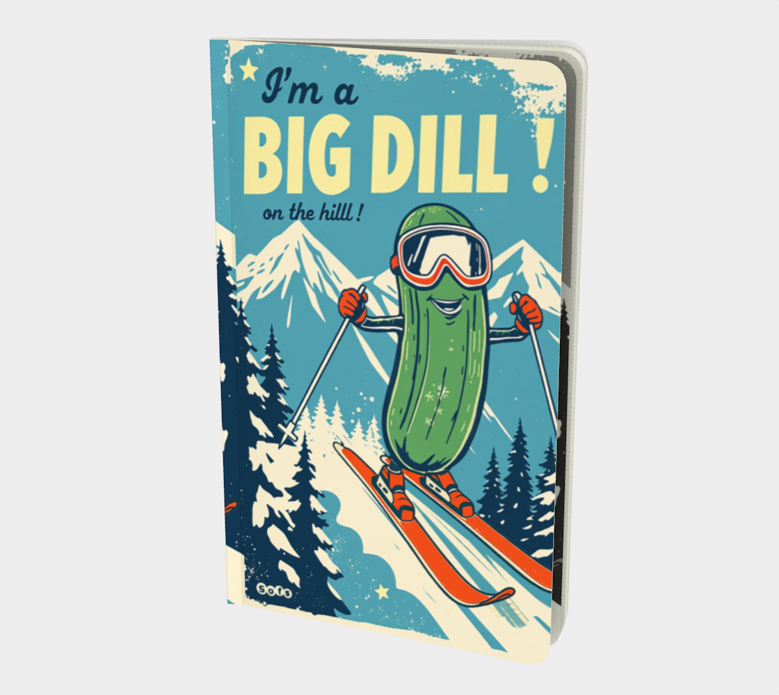 Notebook with a pickle character skiing and text 'I'm a BIG DILL on the hill!' against a mountain background.